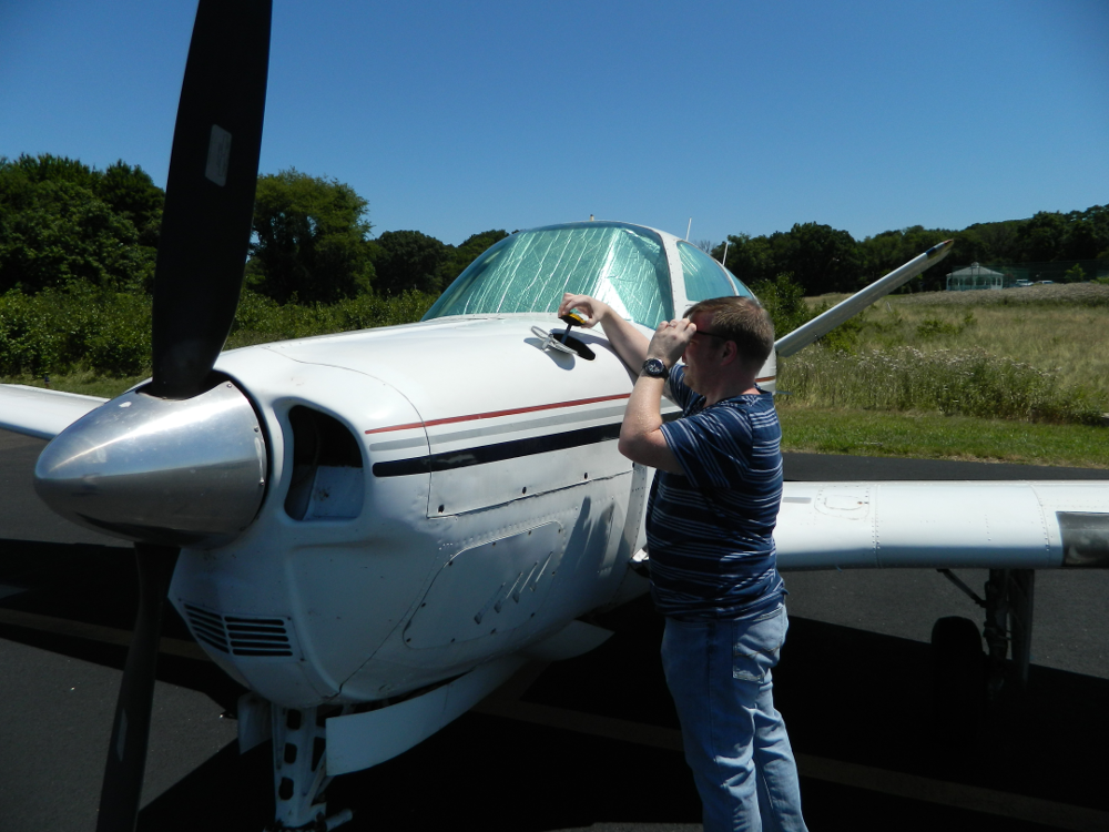 Zack-checks-the-oil-in-Big-Boy-before-the-flight