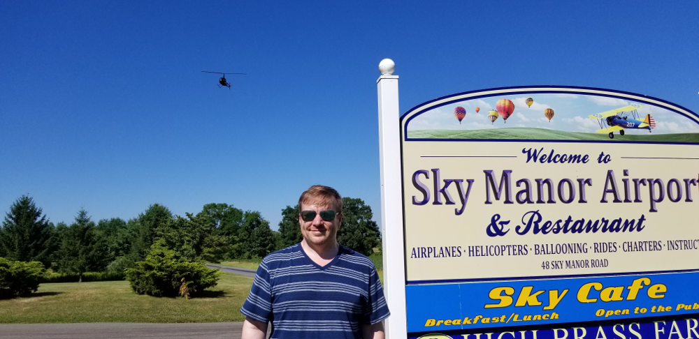 Zack-at-the-Sky-Manor-sign-with-Helicopter-on-landing