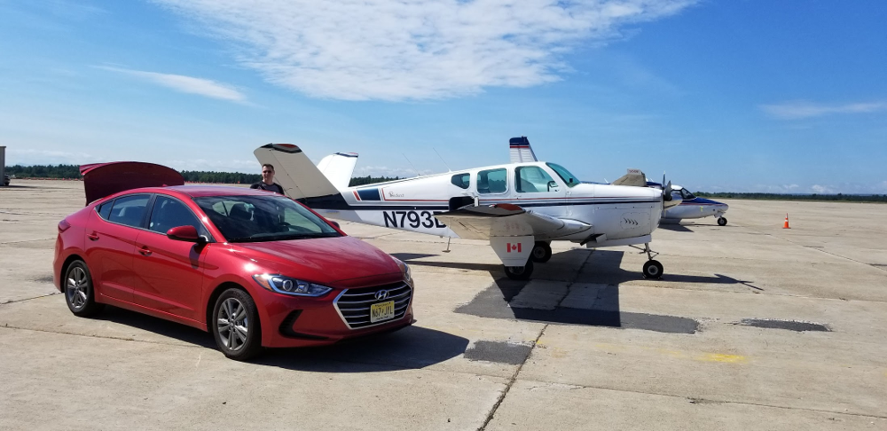 Shawn-loads-the-rental-car-with-the-bags-at-Plattsburgh