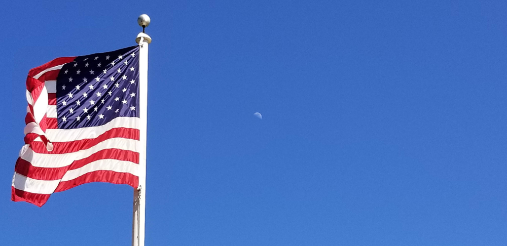 The-American-Flag-Flutters-in-front-of-the-moon-during