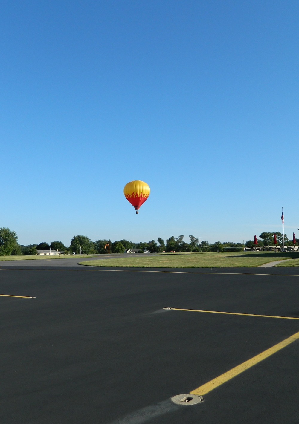 A-red-hot-air-balloon-comes-in-for-a-landing